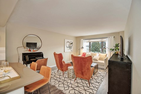 a living room with a table and chairs and a couch